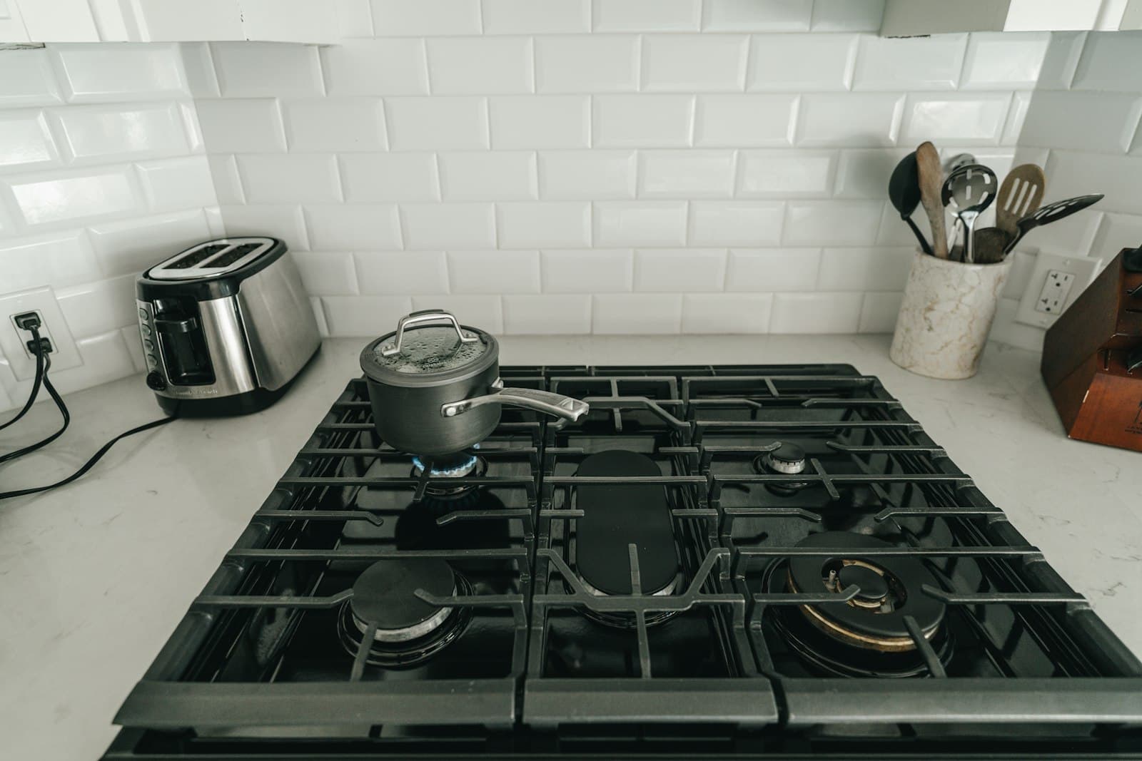 A moka pot heating on a stovetop