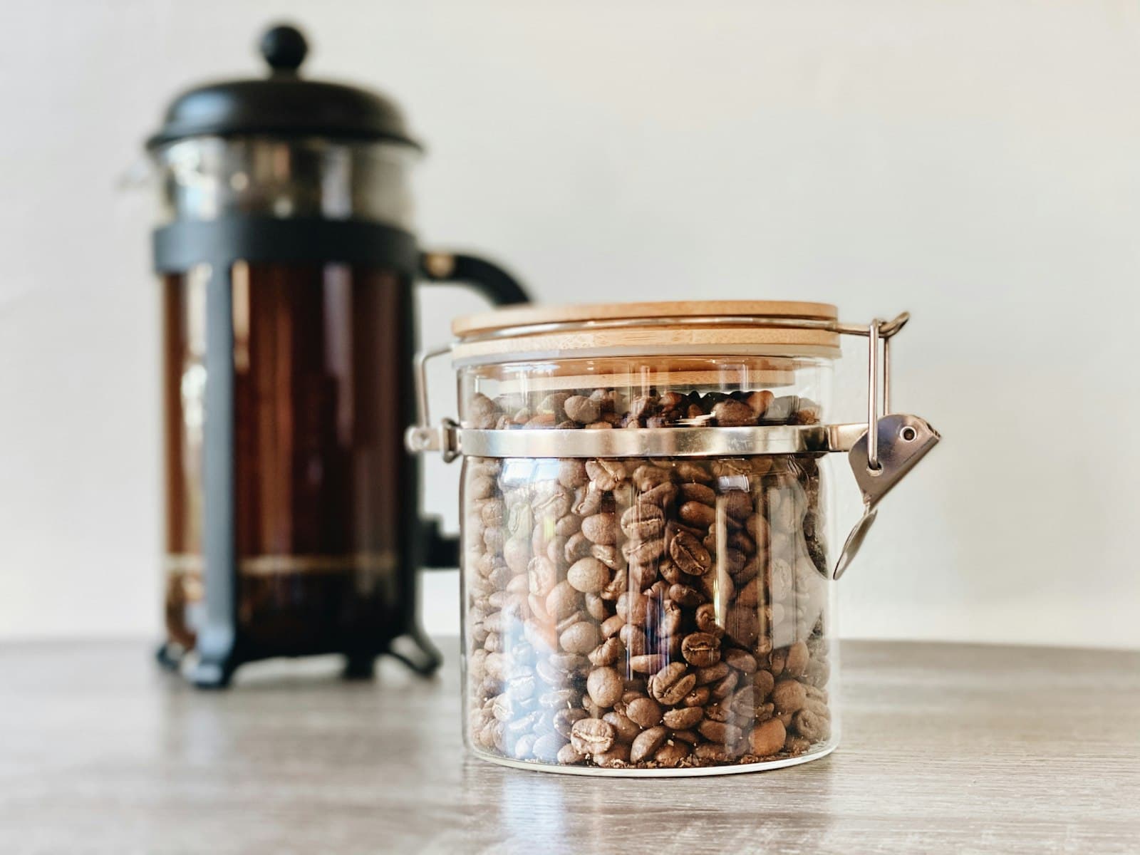 A glass jar of cold brew coffee steeping on a counter