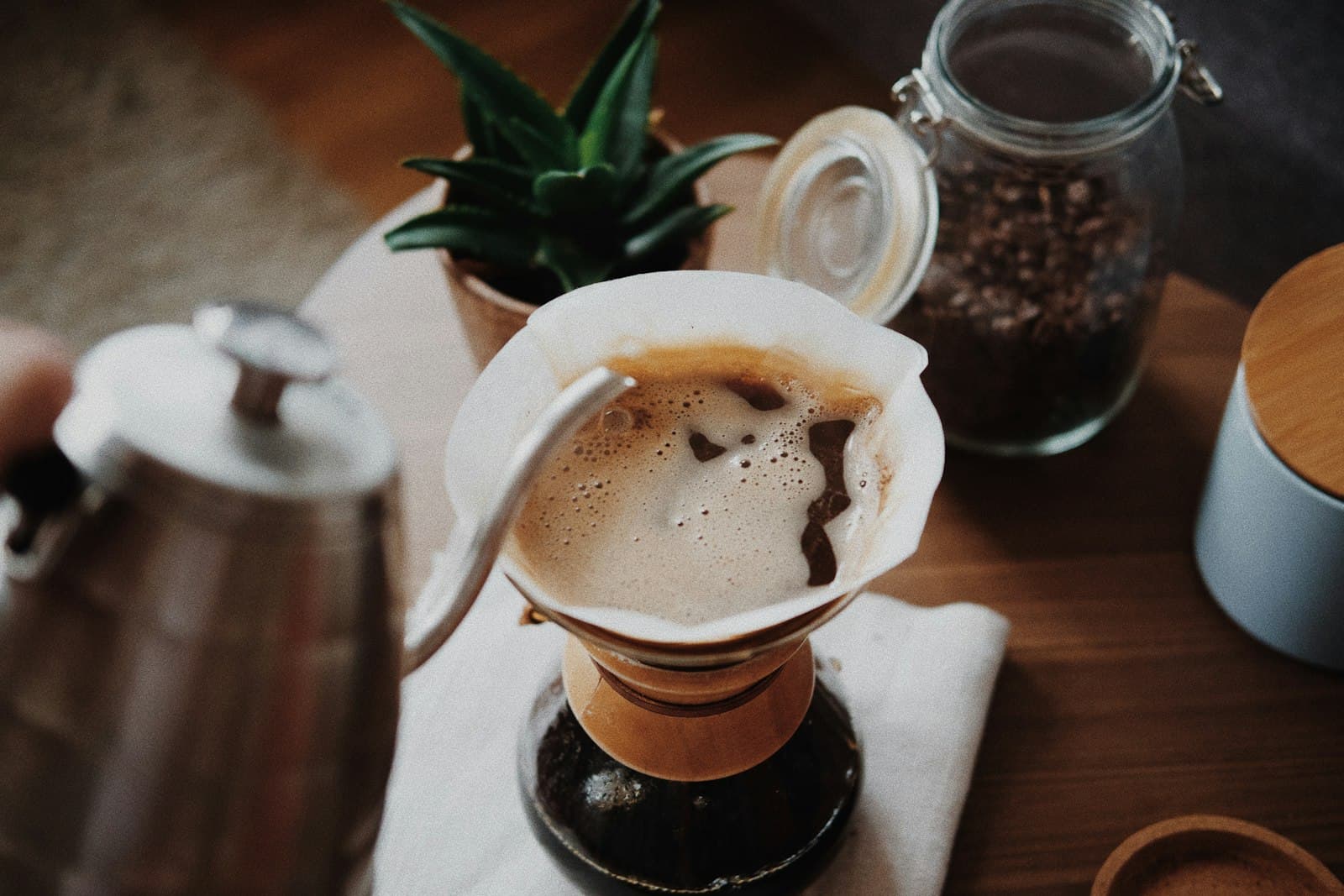 Hot water being poured in circles over a pour-over brewer