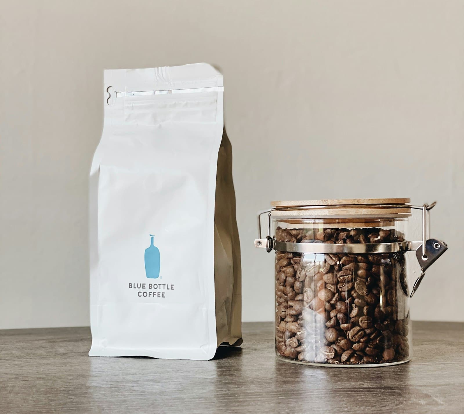 A sealed bag of coffee beans on a wooden table