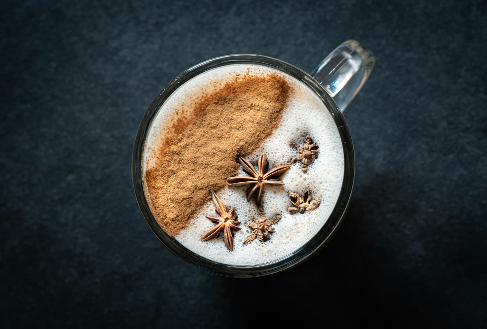 A spiced coffee topped with cinnamon and star anise