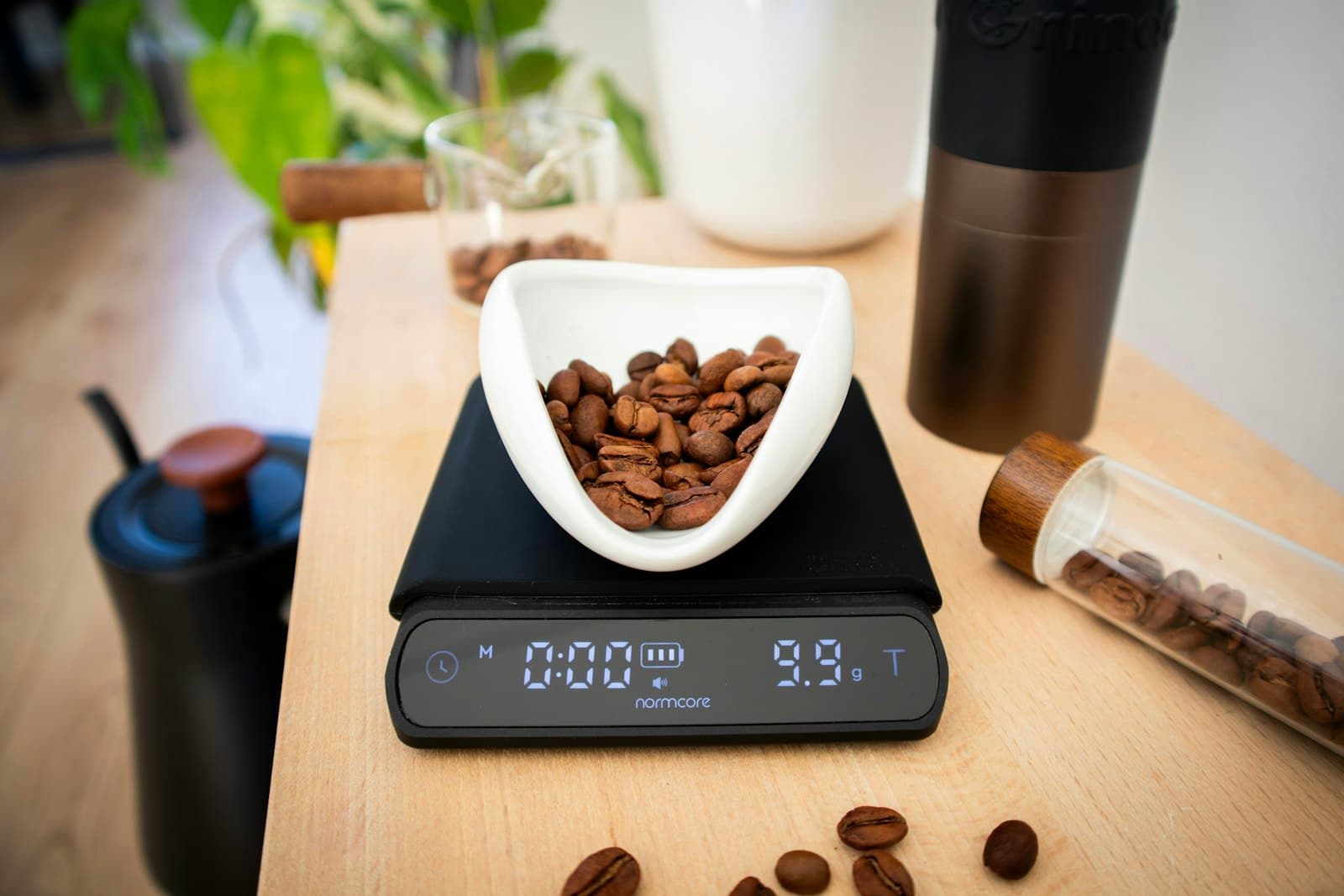 Coffee beans being weighed on a digital brewing scale